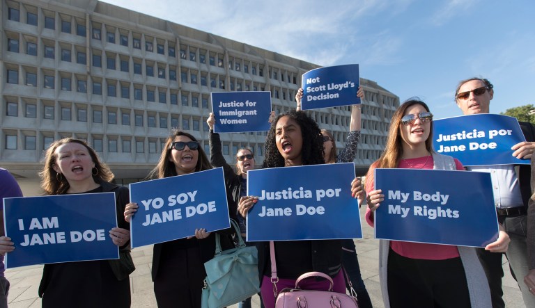 Activists with Planned Parenthood demonstrate in support of a pregnant 17-year-old being held in a Texas facility for unaccompanied immigrant children to obtain an abortion, outside of the Department of Health and Human Services in Washington, Friday, Oct. 20, 2017. (AP Photo/J. Scott Applewhite)
