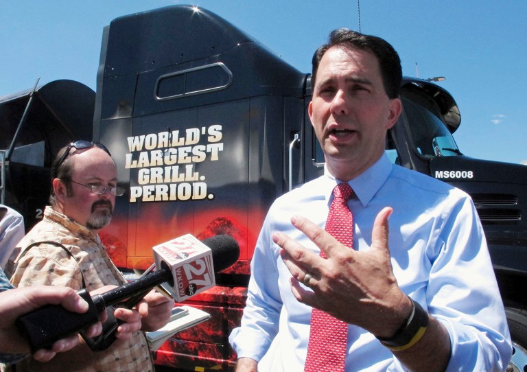 Wisconsin Gov. Scott Walker told reporters following a groundbreaking at a sausage factory that he will follow Wisconsin Republican Party rules and cast his ballot for Texas Sen. Ted Cruz in the first round because Cruz won the state primary. (AP Photo/Scott Bauer)