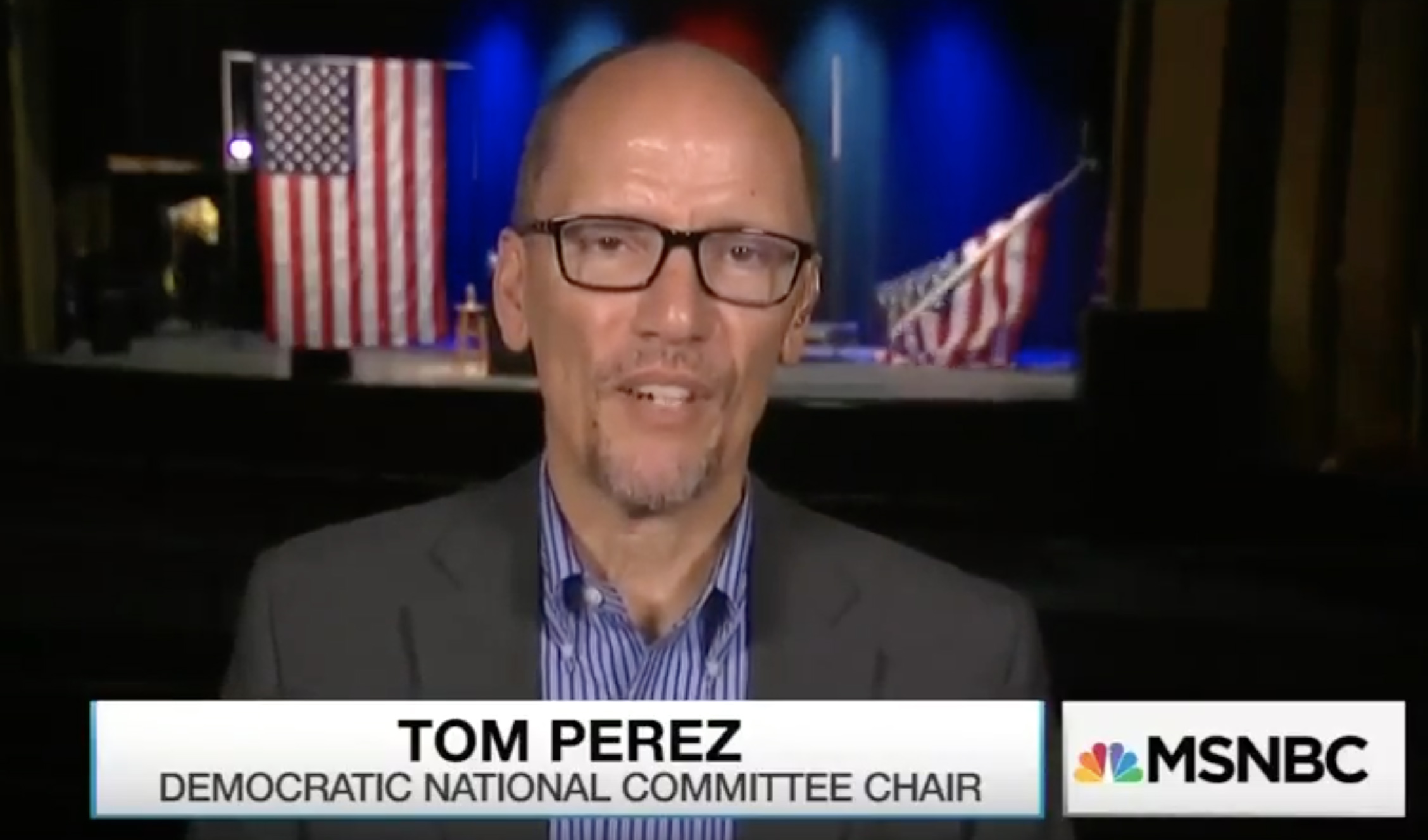 Watch an American flag fall behind DNC chairman Tom Perez as he says Hillary Clinton’s name