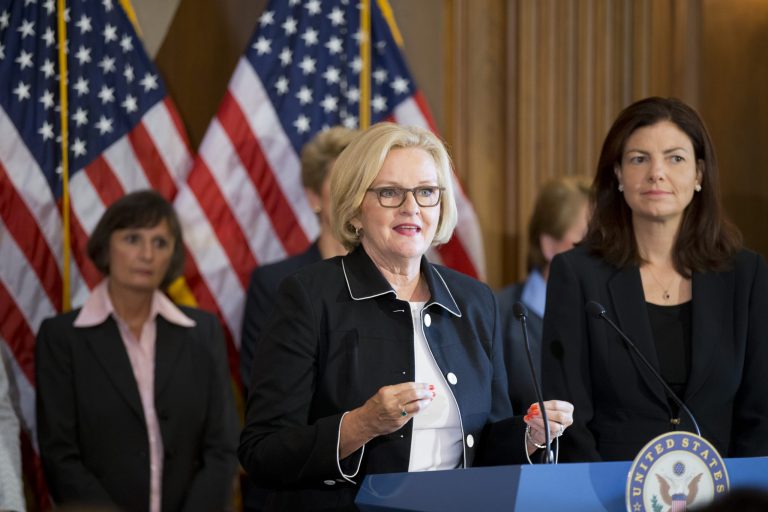 Sen. Claire McCaskill, D-Mo., center, and Sen. Kelly Ayotte, R-N.H., right, are joined by retired female members of the military's judge advocate corps at a news conference on Capitol Hill in Washington, Thursday, July 25, to discuss reforming the way sexual assault cases in the military are prosecuted. (AP/J. Scott Applewhite)