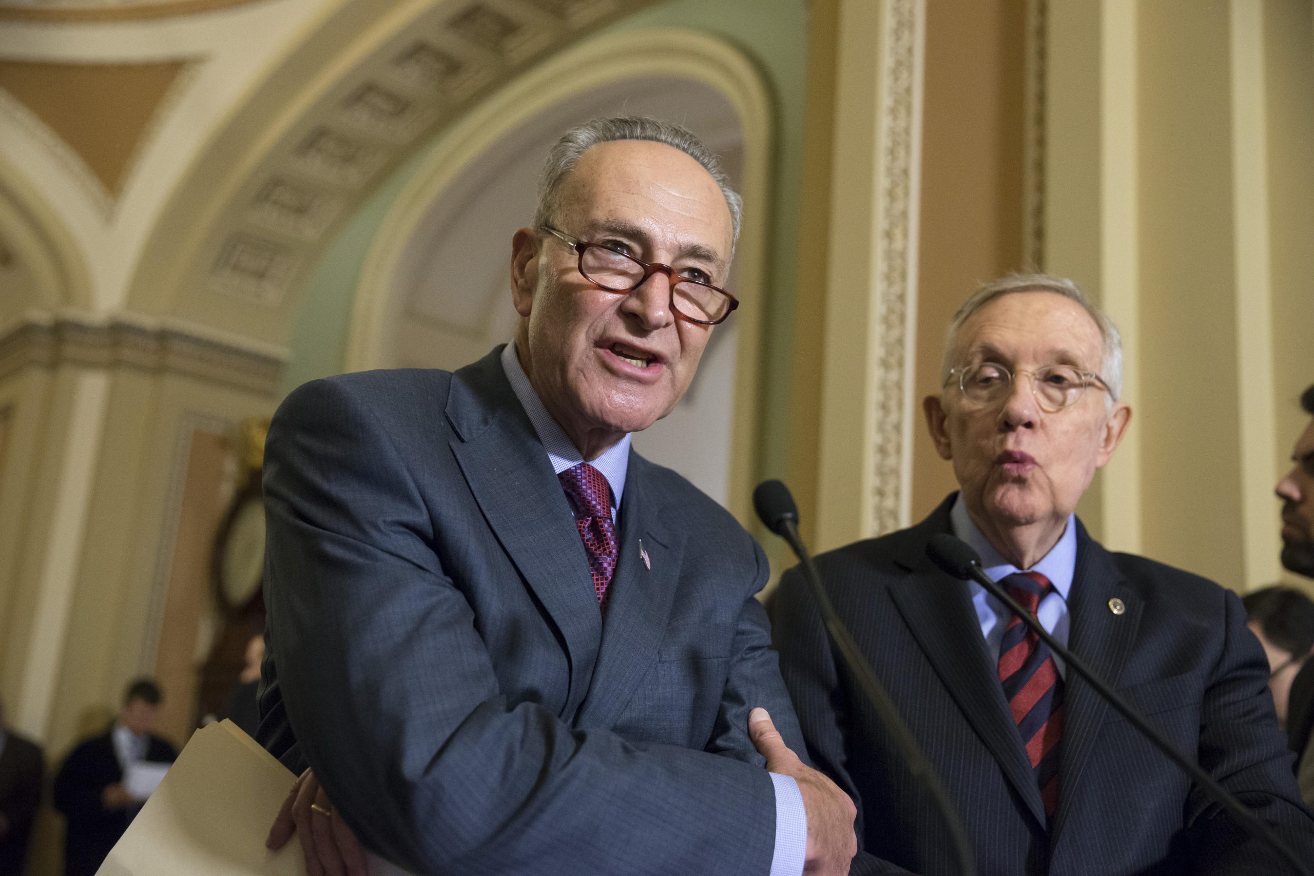 Reid won’t talk about veto override next to Schumer