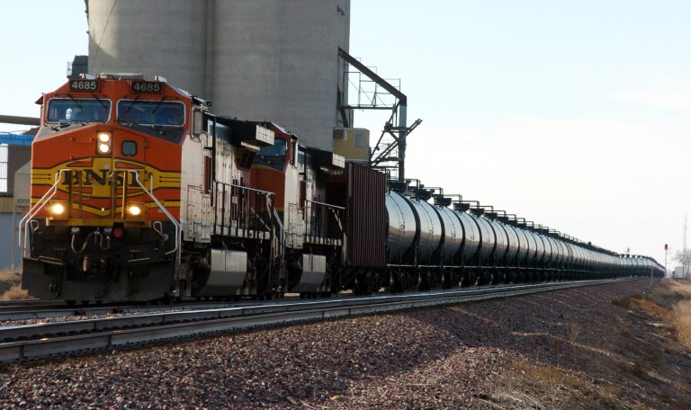 FILE - In this Nov. 6, 2013, file photo, a BNSF Railway train hauls crude oil near Wolf Point, Mont. The U.S. Department of Transportation ordered railroads last month to give state officials specifics on oil train routes and volumes so emergency responders can better prepare for accidents. North Dakota's State Emergency Response Commission unanimously voted to release the state's information Wednesday June 25, 2014. (AP Photo/Matthew Brown, File)