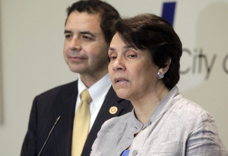Honduran Foreign Minister Mireya Aguero de Corrales talks to the media with U.S. Rep. Henry Cuellar about the current state of illegal immigration during a news conference, Tuesday, Aug. 19, 2014 at the McAllen City Hall in McAllen, Texas. (AP Photo/The Monitor, Gabe Hernandez)
