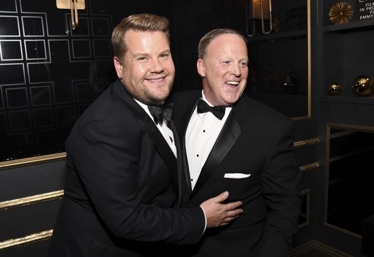 Comedian James Corden apologized for attempting to kiss ex-White House press secretary Sean Spicer on the cheek after the Emmy Awards on Sunday night, after facing a public backlash for the photograph. (Photo by Charles Sykes/Invision for the Television Academy/AP Images)