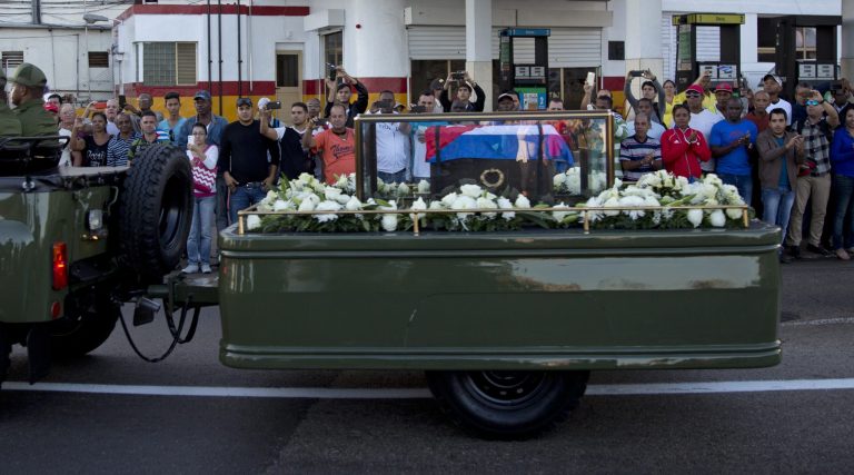 Placed in a small coffin covered by a Cuban flag the ashes of Cuban leader Fidel Castro are driven along the streets of Havana, Cuba. (AP Photo/Natacha Pisarenko)