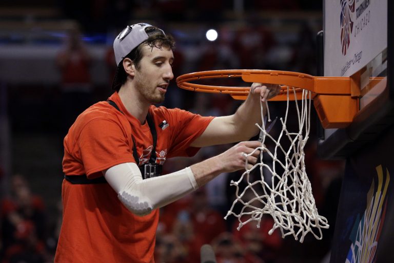 Wisconsin's Frank Kaminsky (44) cuts the net after the Badgers beat Michigan State to win the Big Ten Tournament. [AP Photo]Â 