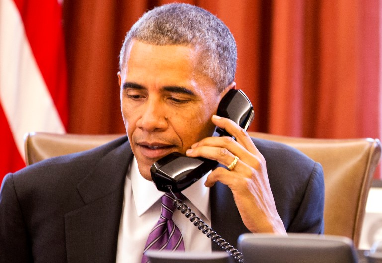President Barack Obama speaks during a phone call in the Oval Office of the White House Wednesday, Oct. 8, 2014, in Washington. (AP Photo/Jacquelyn Martin)