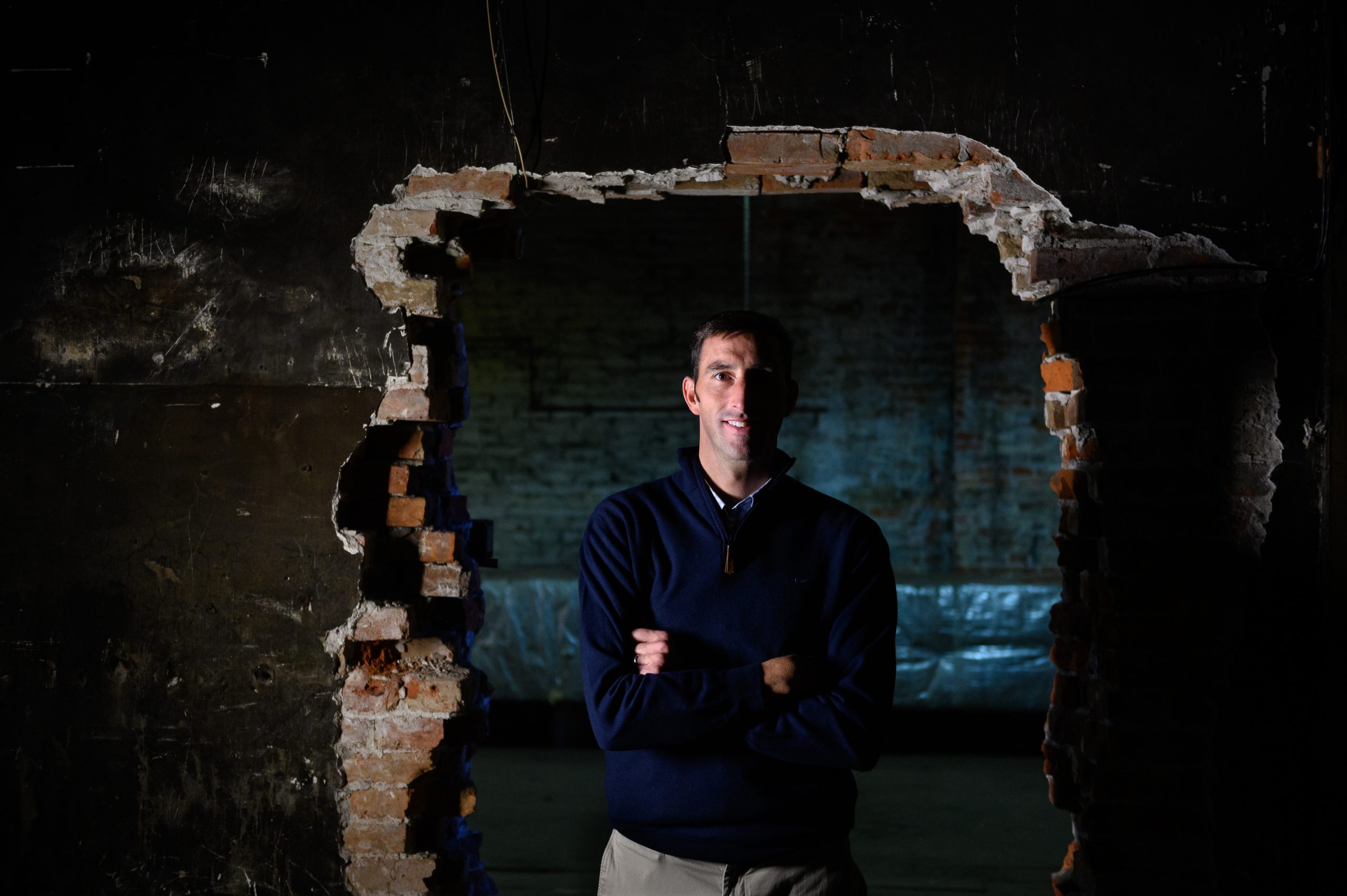 John Persinger, CEO of the Erie Downtown Development Corp., stands in one of the buildings that the corporation purchased along State Street and North Park Row in Erie, Pennsylvania.