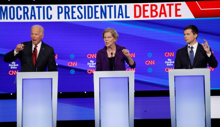 Democratic presidential candidate former Vice President Joe Biden, left, Sen. Elizabeth Warren, D-Mass., center and South Bend Mayor Pete Buttigieg speak during a Democratic presidential primary debate hosted by CNN/New York Times at Otterbein University, Tuesday, Oct. 15, 2019, in Westerville, Ohio.