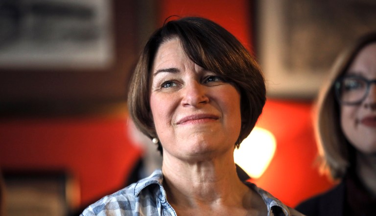 Sen. Amy Klobuchar, D-Minn., listens as she is introduced during a campaign stop at The Village Trestle in Goffstown, N.H., Monday, Feb. 18, 2019.