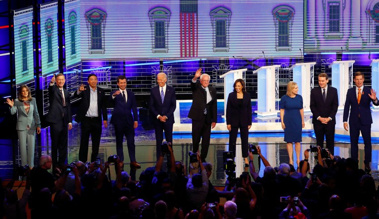 Democratic presidential candidates from left, author Marianne Williamson, former Colorado Gov. John Hickenlooper, entrepreneur Andrew Yang, South Bend Mayor Pete Buttigieg, former Vice-President Joe Biden, Sen. Bernie Sanders, I-Vt., Sen. Kamala Harris, D-Calif., Sen. Kristen Gillibrand, D-N.Y., former Colorado Sen. Michael Bennet and Rep. Eric Swalwell, D-Calif., wave as they enter the stage for the second night of the Democratic primary debate hosted by NBC News at the Adrienne Arsht Center for the Performing Arts, Thursday, June 27, 2019, in Miami.