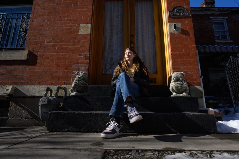 Lena Carson, 14, sits in front of her home Feb. 4 in Pittsburghâs Mexican War Streets neighborhood. 