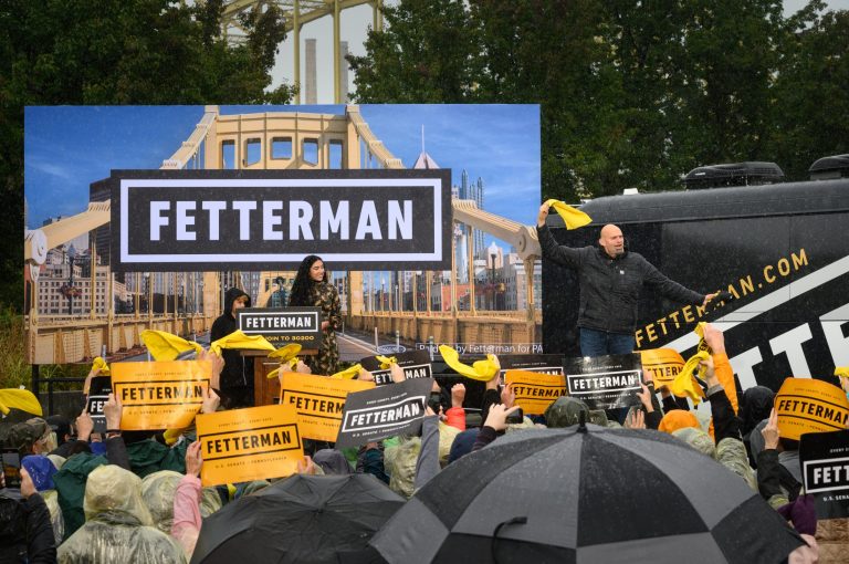 John Fetterman, lieutenant governor of Pennsylvania and Democratic senate candidate, walks to the stage during a campaign rally in Pittsburgh, Pennsylvania, on Oct. 1