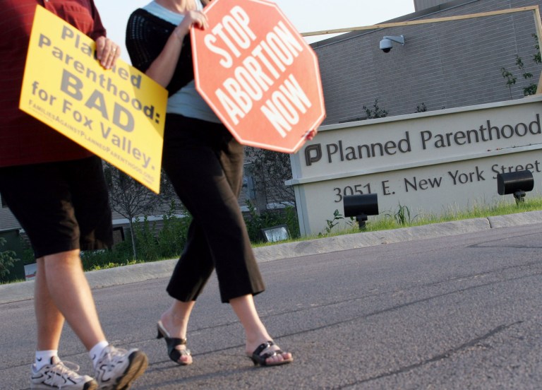In this Sept. 18, 2007, file photo, protesters march near a Planned Parenthood location in Aurora, Ill. (AP Photo)Â 