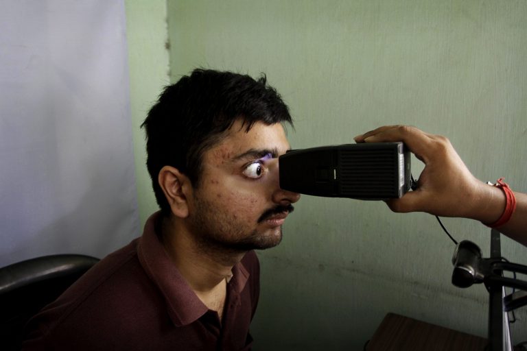 A man gets his retina scanned as he enrolls in an identification program. (AP/Bikas Das)