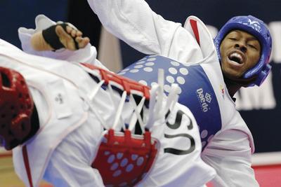 David Zalubowski/AP
Alexandria's Terrence Jennings became one of four members of the taekwondo team that will represent America in the London Games this summer after he beat Mark Lopez in qualifying.