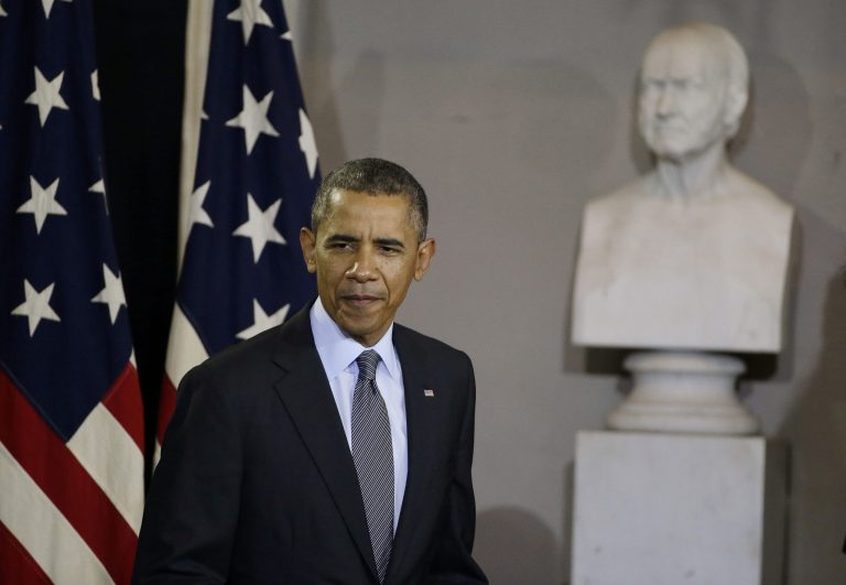 President Obama enters to speak at Boston's historic Faneuil Hall about the federal health care law on Wednesday. (AP Photo/Stephan Savoia)