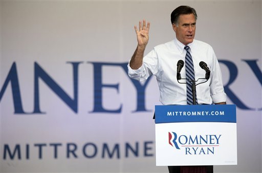 FILE - In this Oct. 23, 2012, file photo, Republican presidential candidate, former Massachusetts Gov. Mitt Romney speaks to a crowd of supporters during a rally in Henderson, Nev., as he holds up 4 fingers and asks if they want 4 more years of a bad economy. No region in America has seen more presidential campaign commercials. Last week alone, Romney's campaign and its allies spent $3.6 million on Nevada commercials, while President Barack Obama and his supporters spent $2.7 million. (AP Photo/Julie Jacobson, File)