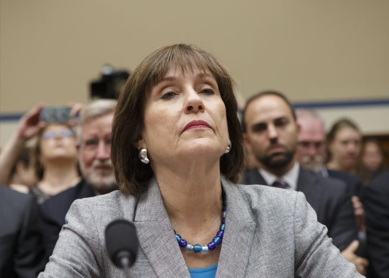 FILE - In this May 22, 2013 file photo, Internal Revenue Service official Lois Lerner refuses to answer questions as the House Oversight Committee holds a hearing to investigate the extra scrutiny the IRS gave Tea Party and other conservative groups that applied for tax-exempt status, on Capitol Hill in Washington. The House Ways and Means Committee voted Wednesday, April 9, 2014,  to refer Lerner to the Justice Department for possible criminal prosecution in the agency's tea party controversy. On Thursday, the House Oversight Committee and its tenacious chairman, Darrell Issa, R-Calif., has scheduled a vote on whether to hold Lerner in contempt of Congress for not responding to questions at two Oversight hearings. (AP Photo/J. Scott Applewhite, File)