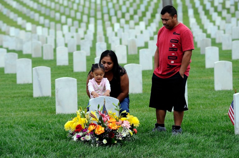 To bridge the divide and help our fellow citizens better understand our service and sacrifice, we have to tell our stories openly and let them hear our voices. (AP Photo/Nick Ut)
