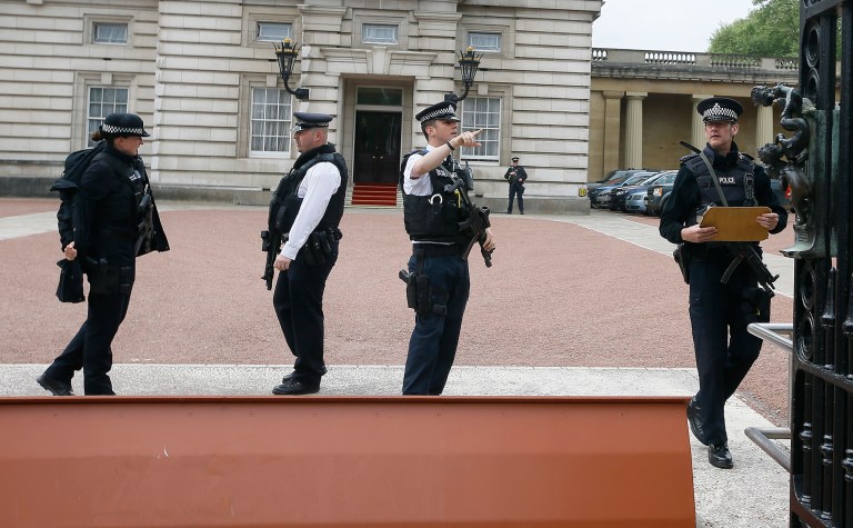 British police say they have arrested a man who scaled a wall and got into the grounds of Buckingham Palace. (AP Photo/Kirsty Wigglesworth)