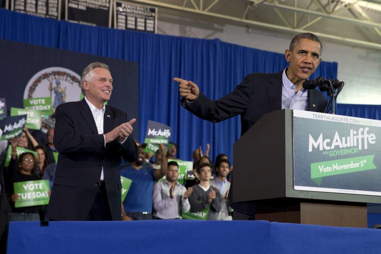 President Obama speaks at a campaign event for Virginia Democratic gubernatorial candidate Terry McAuliffe, left, at Washington-Lee High School in Arlington, Va., on Sunday. (AP Photo/Jacquelyn Martin)