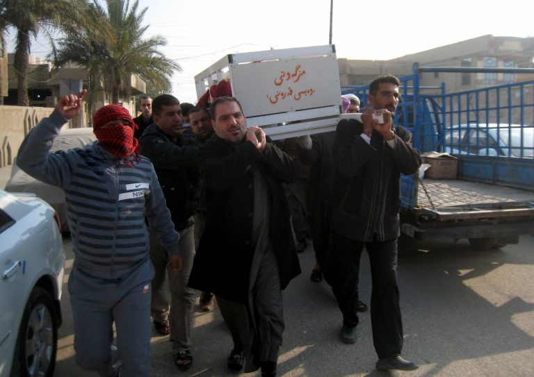 In this Thursday, Jan. 23, 2014 photo, mourners carry the coffin of Haitham Abdo Rahman, 38, who was killed in a bombing, before his burial at the cemetery in Fallujah, Iraq. Islamic militants controlling a mainly Sunni area west of Baghdad are so well-armed that they could occupy the capital, members of Iraq's al-Qaida branch - known as the Islamic State of Iraq and the Levant - have taken over parts of Ramadi, the capital of the largely Sunni western province of Anbar. (AP Photo)