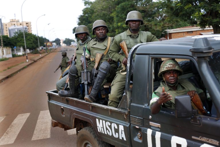 FILE-In this file photo taken on Thursday, May 29, 2014, African Union MISCA  troops from Cameroon patrol in Bangui, Central African Republic.  The United Nations took over a regional African peacekeeping mission in Central African Republic on Monday, Sept. 15,  nine months after sectarian violence erupted that has left at least 5,000 people dead and has forced tens of thousands of Muslims to flee into exile in neighboring countries. (AP Photo/Jerome Delay,File)