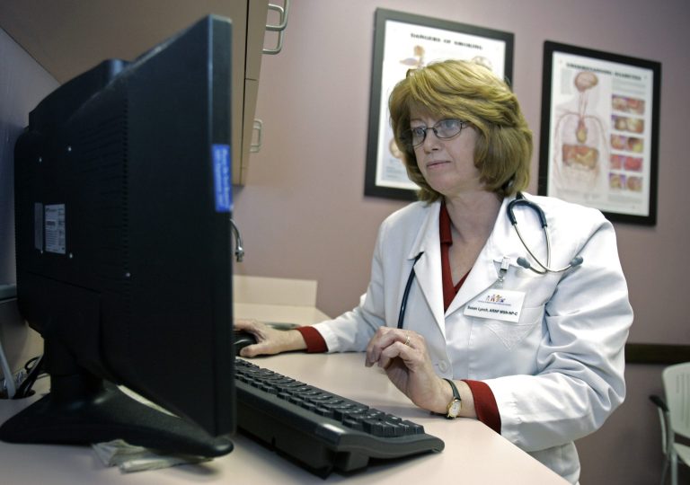 Susan Lynch, a nurse practitioner, checks over a patients electronic medical records, at the Central Florida Family Health Center in Sanford, Fla., Monday, March 2, 2009. (AP Photo/John Raoux)