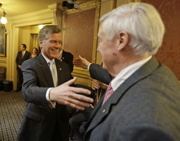 Virginia Gov. Bob McDonnell, left, and House speaker, Del. William Howell, share a laugh and an embrace as they were awarded the Best Friends Forever award on the floor of the House at the Capitol in Richmond, Va., Friday, Feb. 22, 2013.  Several of the House members give out humorous awards to members as part of the sensitivity caucus. (AP Photo/Steve Helber)