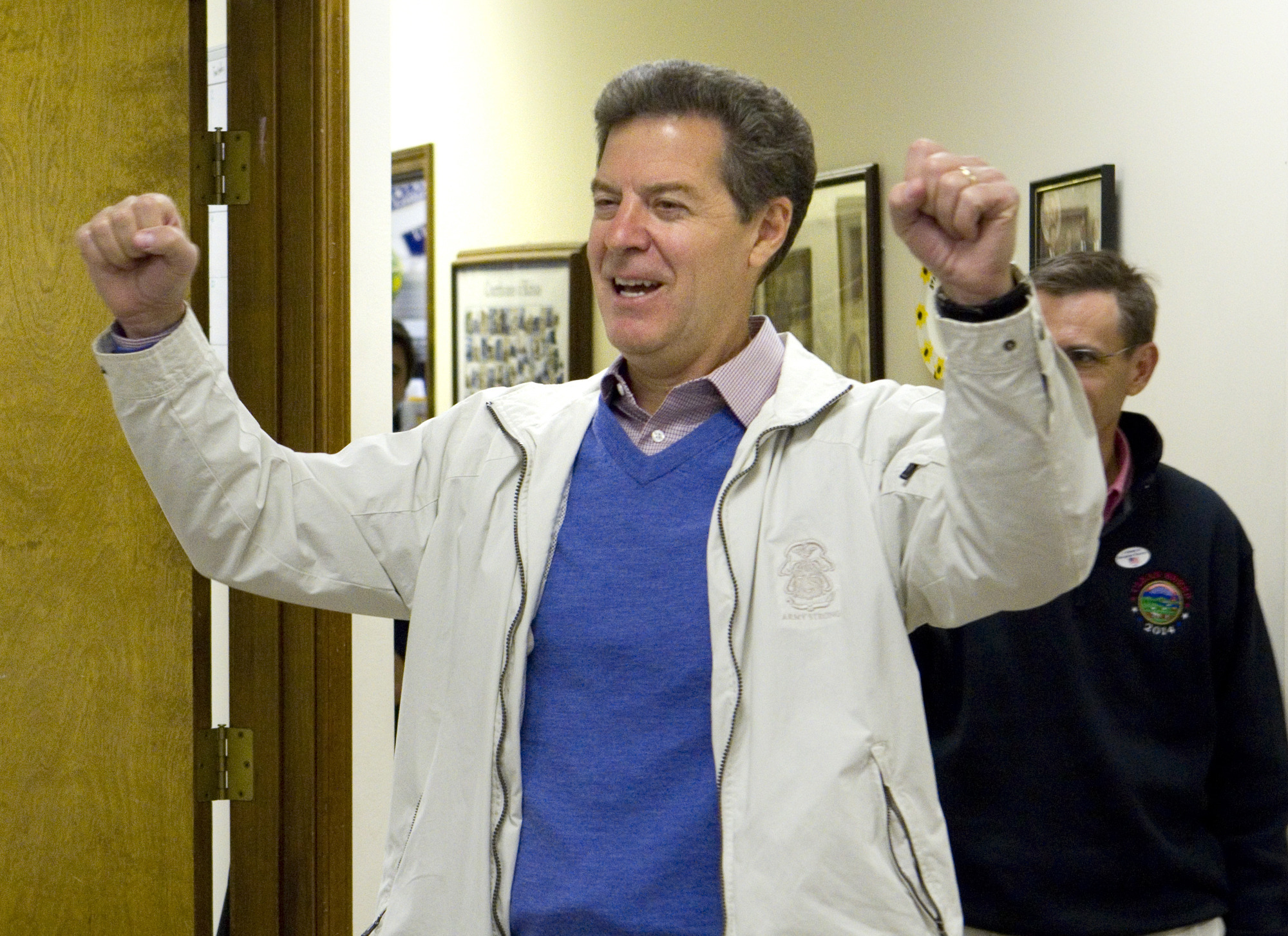 Kansas Gov. Sam Brownback hangs on for close victory