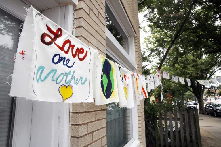 Painted cloth flags including one saying 