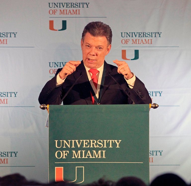 Colombian President Juan Manuel Santos speaks at the Newman Alumni Center at the University of Miami in Coral Gables, Fla., on Monday, Dec. 2, 2013. Santos was invited to speak by the president of the University of Miami, Donna E. Shalala, the Center for Latin American Studies and the Center for Hemispheric Policy. (AP Photo/El Nuevo Herald, C.M. Guerrero) MAGS OUT