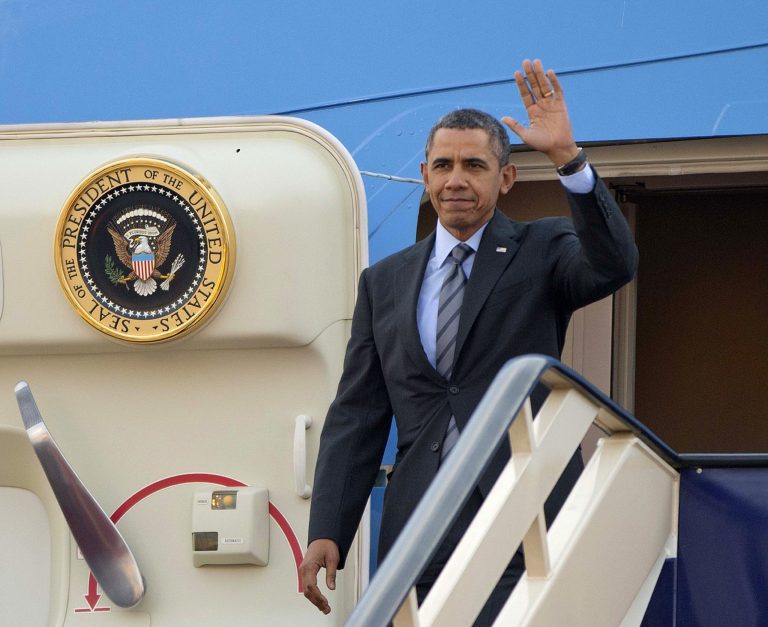 President Barack Obama waves as he gets off Air Force One upon his arrival at King Khalid International airport in Riyadh, Saudi Arabia, Friday, March 28, 2014. President Barack Obama is in Saudi Arabia to reassure the key Gulf ally that his commitment to the Arab world isn't wavering.  (AP Photo/Pablo Martinez Monsivais)