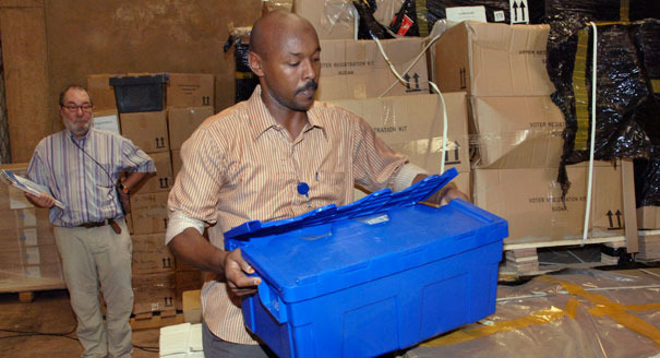 A Sudanese worker handles materials related to a USAID program in 2010. AP Photo