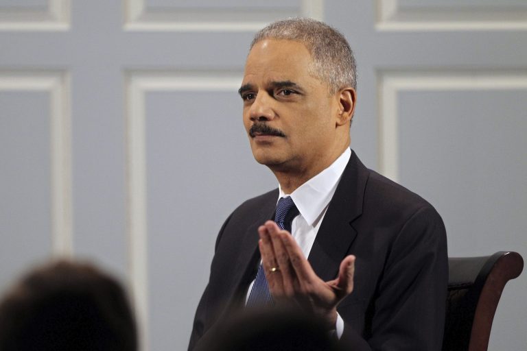 Attorney General Eric Holder speaks during an interview with Douglas Blackmon on Thursday at the University of Virginia in Charlottesville. (AP Photo / The Daily Progress, Ryan M. Kelly)