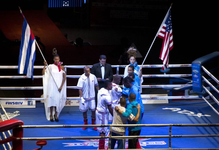 Cuban and U.S. boxers greet each other before the start of competition in Havana, Cuba, Friday, April. 4, 2014. Boxers from the U.S. and Cuba went glove-to-glove on Cuban soil for the first time in 27 years Friday in a semipro World Series of Boxing clash. (AP Photo/Ramon Espinosa)