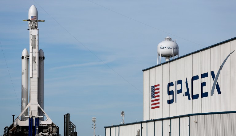 In this photo from Monday, a Falcon 9 SpaceX heavy rocket stands ready for launch on pad 39A at the Kennedy Space Center in Cape Canaveral, Fla. The Falcon Heavy launched Tuesday afternoon with three first-stage boosters, strapped together with 27 engines in all. (AP Photo/Terry Renna)