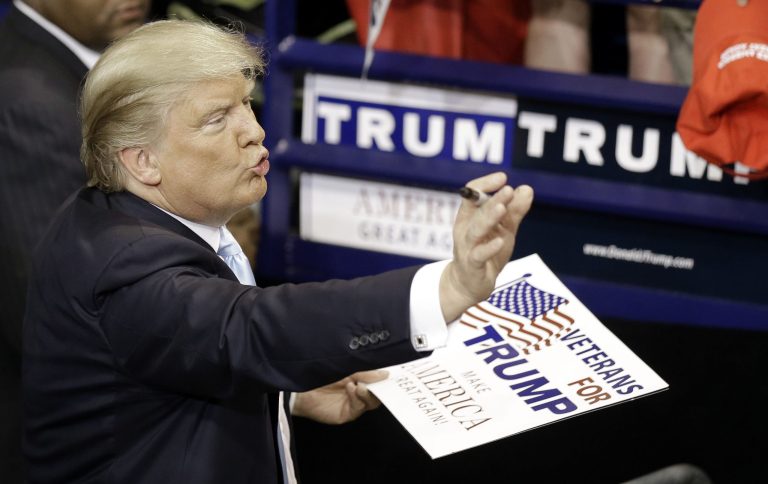 Republican presidential candidate Donald Trump signs autographs during a campaign rally in Fayetteville, N.C., Wednesday, March 9, 2016. (AP Photo/Gerry Broome)