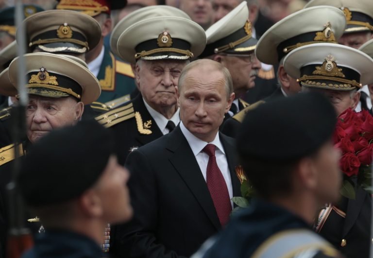 Russian President Vladimir Putin attends a parade marking the Victory Day in Sevastopol, Crimea, Friday, May 9, 2014. Presiding over a triumphant spectacle of warships and fighter jets, Putin hailed the return of Crimea to Russia as the restoration of 