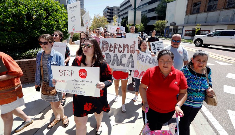Under the Tillis and Lankford bill, recipients would have to meet other requirements such as passing a criminal background check, and follow one or a combination of three merit-based paths in order to show they are productive members of their communities. (AP Photo/Rogelio V. Solis)