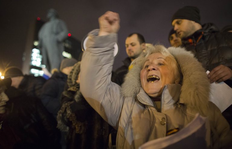 Pro-Russia protesters shout slogans during a small demonstration in Donetsk, eastern Ukraine, Wednesday, Feb. 26, 2014. President Vladimir Putin on Wednesday ordered massive exercises involving most military units in western Russia amid tensions in Ukraine. (AP Photo/Darko Bandic)