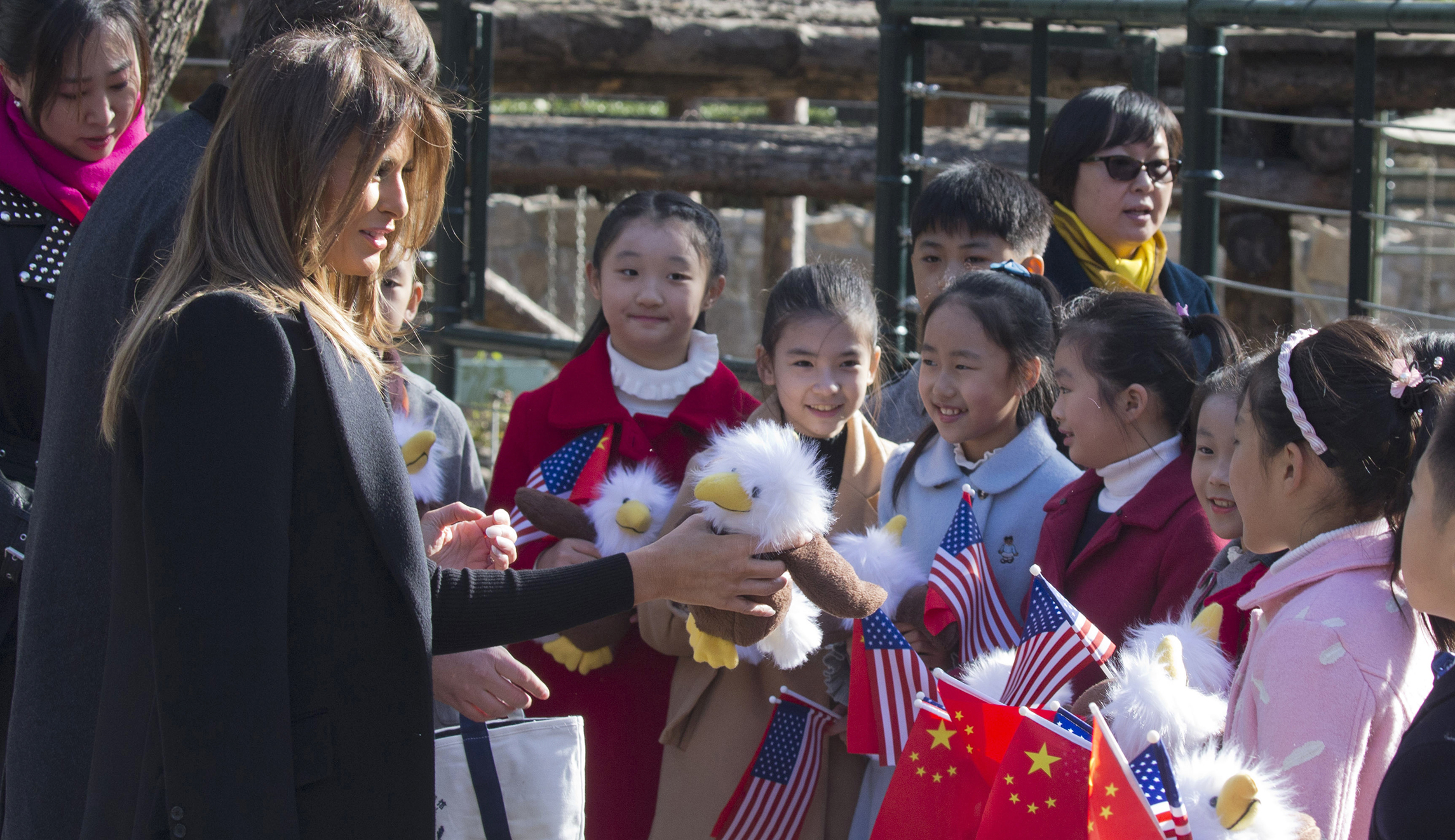 Melania Trump hands out stuffed eagles to children at Beijing Zoo