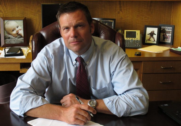 Kansas Secretary of State Kris Kobach, the architect of the state's proof-of-citizenship law for new voters, is pictured on Aug. 1 in Topeka, Kan. (AP Photo/John Hanna)