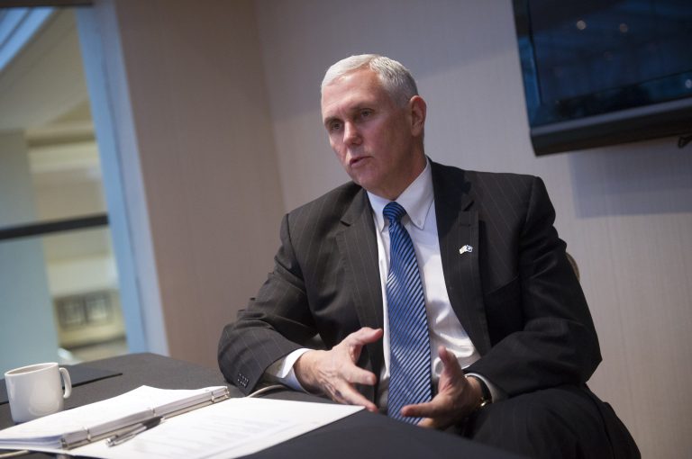Indiana Gov. Mike Pence speaks with the Associated Press during the opening news conference at the National Governors Winter Meeting in Washington, Saturday, Feb. 21, 2015. (AP Photo/Cliff Owen)