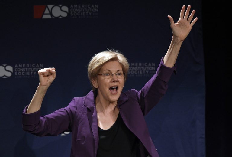 Sen. Elizabeth Warren, D-Mass., gestures to the crowd after speaking at the American Constitution Society for Law and Policy 2016 National Convention, Thursday, June 9, 2016, in Washington. (AP Photo/Nick Wass)