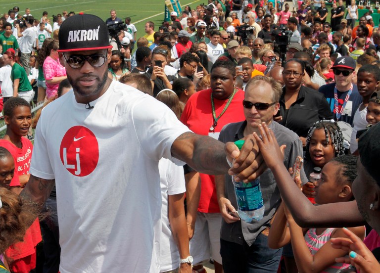 Hillary Clinton touted her endorsement from LeBron James, and said that she has a lot in common with the Cleveland Cavaliers' star player. (AP Photo/Akron Beacon Journal, Phil Masturzo, File)