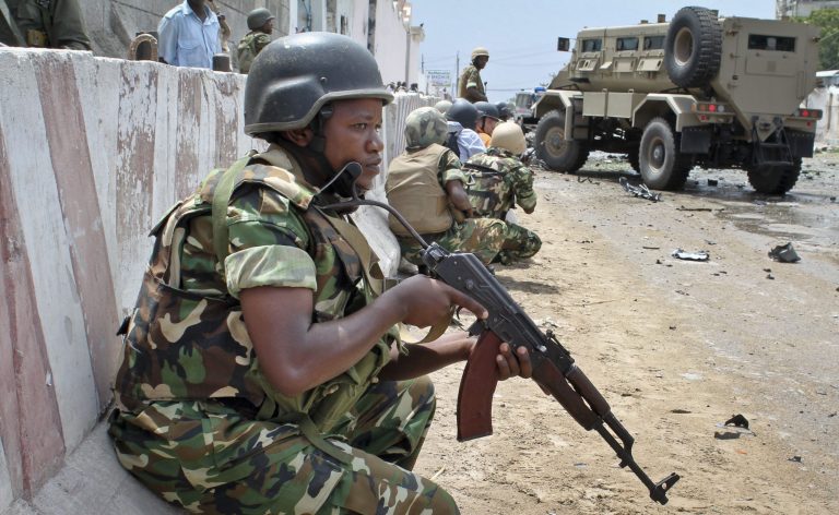 Farah Abdi Warsameh/AP 
African Union peacekeepers take position outside the main U.N. compound, following an attack on it in Mogadishu, Somalia.