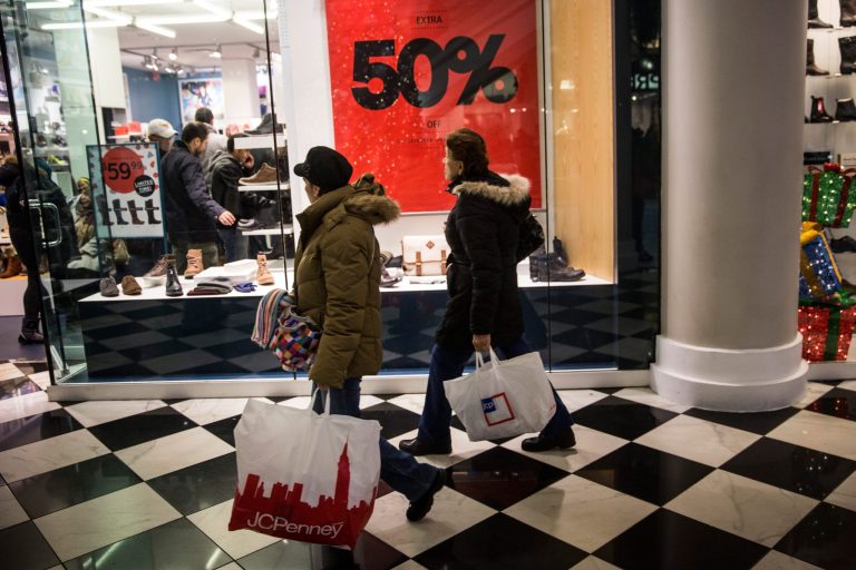 People shop on November 28, 2014, Black Friday. Analysts do their best to factor in the frenzied shopping during this quarter as they calculate GDP. (Photo by Andrew Burton/Getty Images)