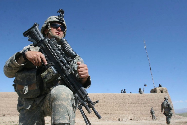 U.S. soldiers from the 82nd Airborne division stand guard outside a forward base near Chinar village in the Ghorak district of Kandahar, in southern Afghanistan, in March 2007. (AP Photo / Rafiq Maqbool)